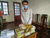 Bị can Hoàng Văn Luân cùng tang vật vụ án